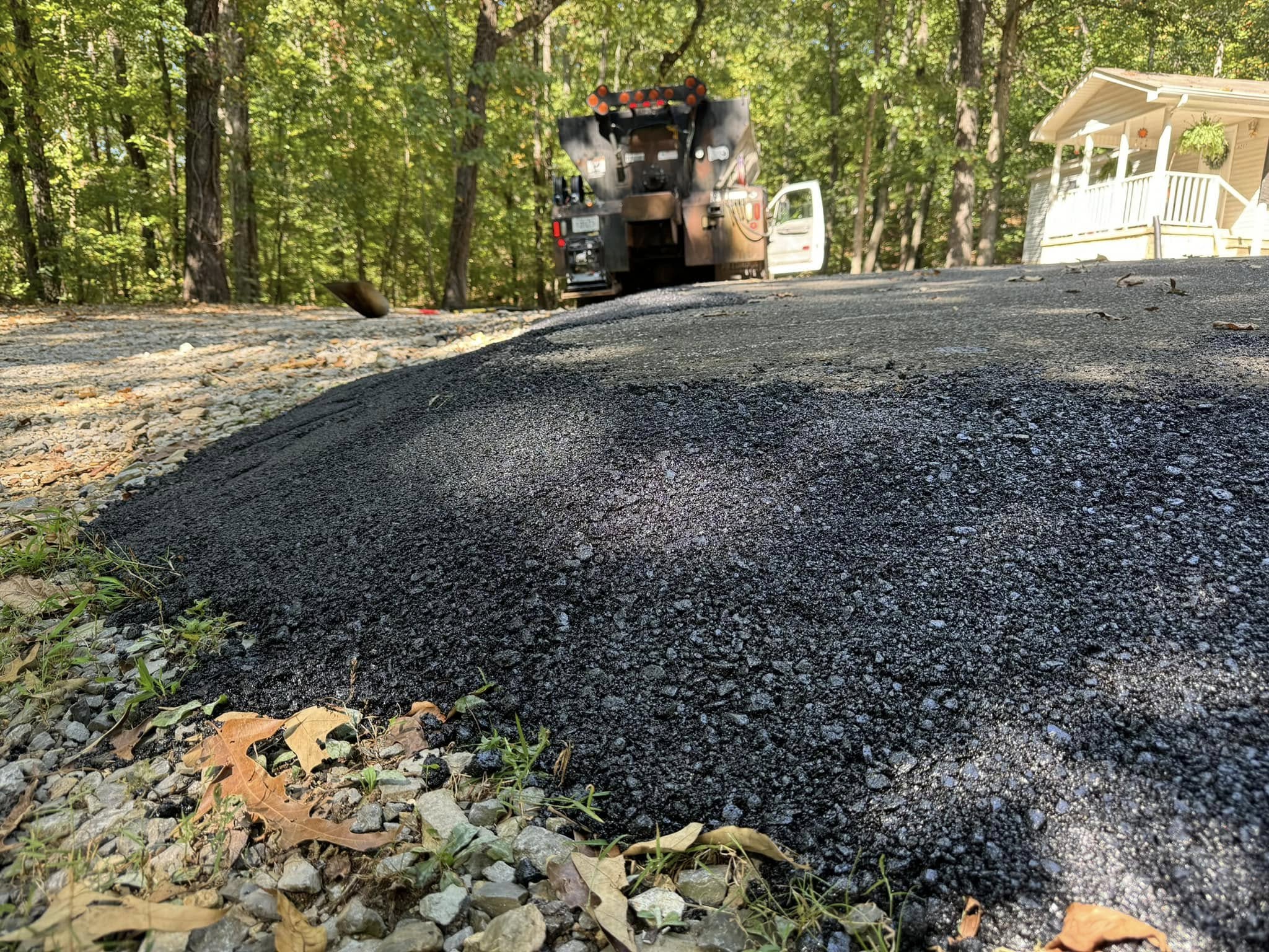 Large asphalt patch with equipment